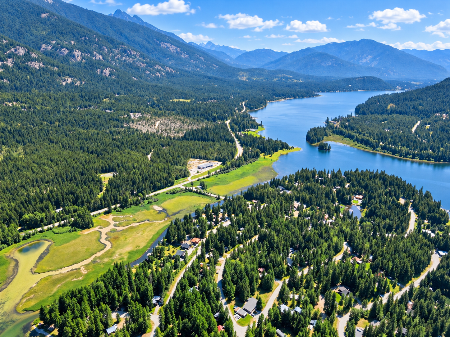 Panoramic aerial of Bull Lake winding between forested mountains near Troy in northwest Montana