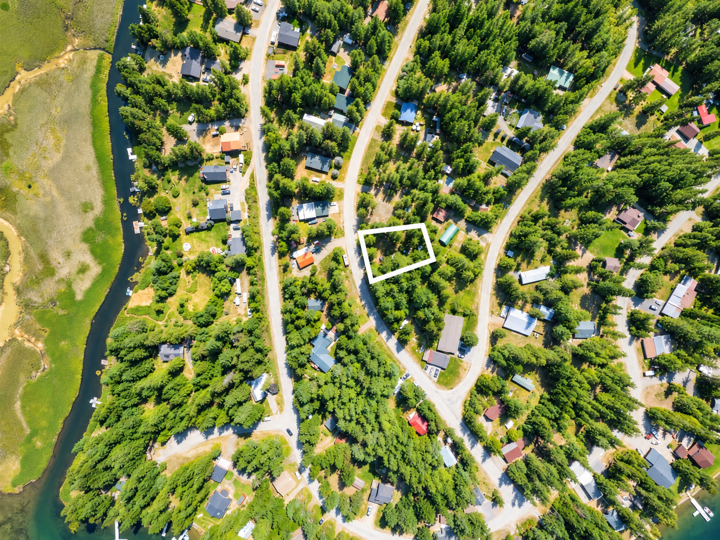Top-down aerial of the 0.26-acre Angel Island parcel boundaries beside a curving road near Bull Lake